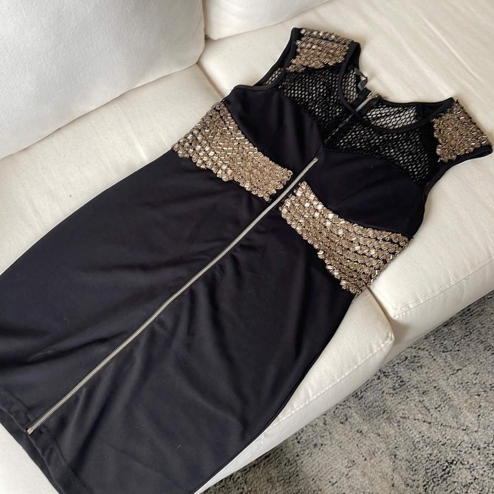 Worn once. European beaded, black mesh, faux zipper dress. A few loose beads